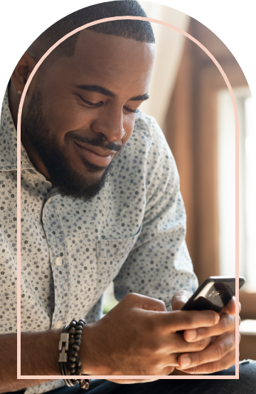 Man typing on mobile phone